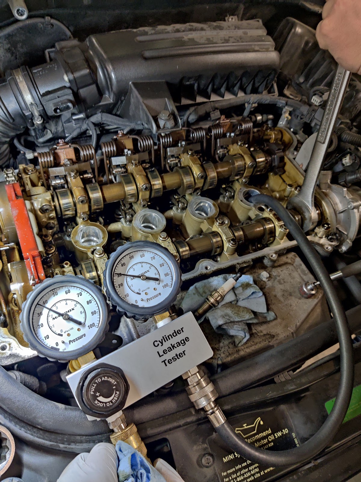 Alex at AR Mechanic running a cylinder leakage test on an engine